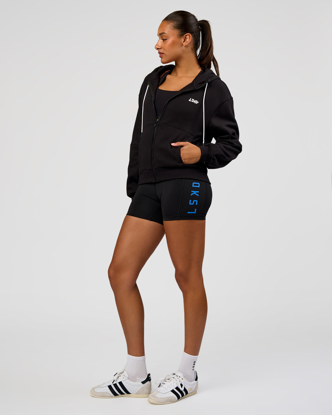 Woman wearing Run Fast Lift Heavy Hoodie - Black-White | Model:Rosie | Size:S