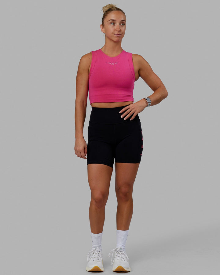 Woman wearing Run Tank - Magenta-White