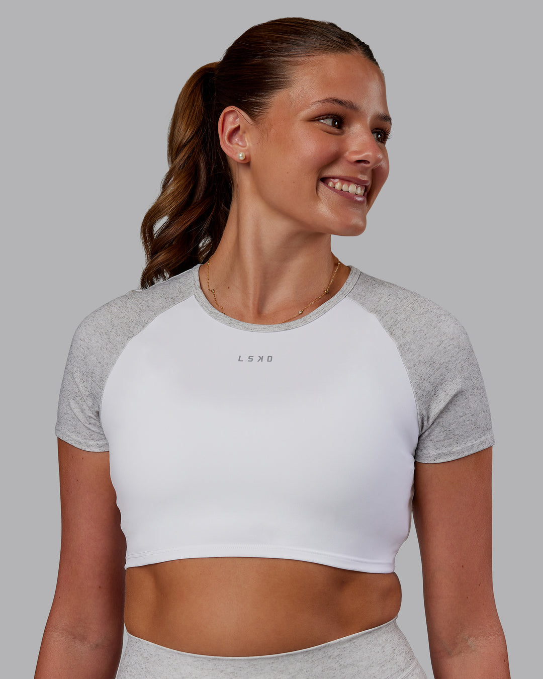 Woman wearing Run With It Ultra Cropped Tee - White-Grey Marl | Model:Phoebe | Size:S
