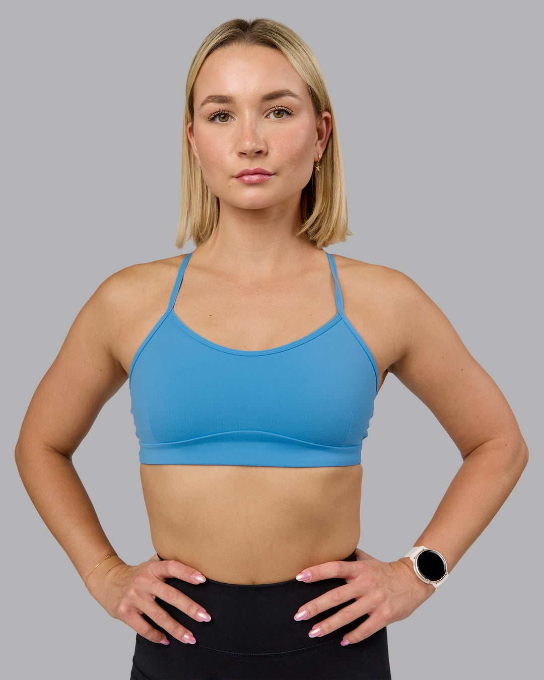 Woman wearing Rush Sports Bra - Azure Blue | Model:Halle | Size:S