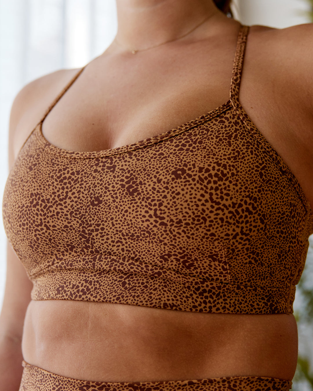 Woman wearing Rush Sports Bra - Caramel-Agile Print | Model:Chantelle | Size: