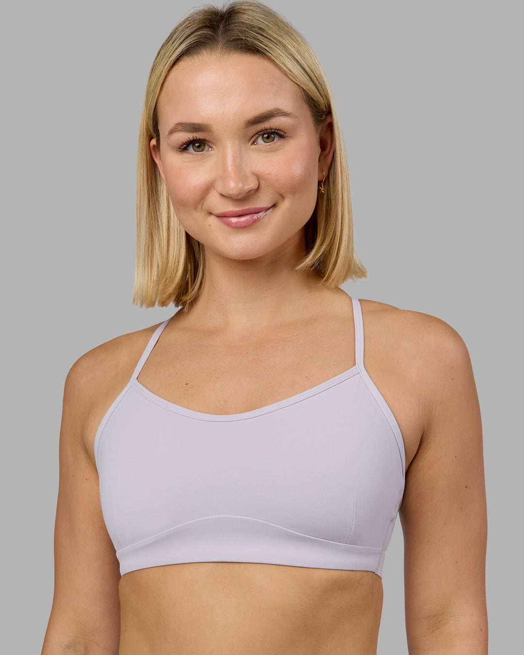 Woman wearing Rush Sports Bra - Lilac Smoke | Model:Halle | Size:S