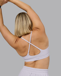 Woman wearing Rush Sports Bra - Lilac Smoke | Model:Halle | Size:S