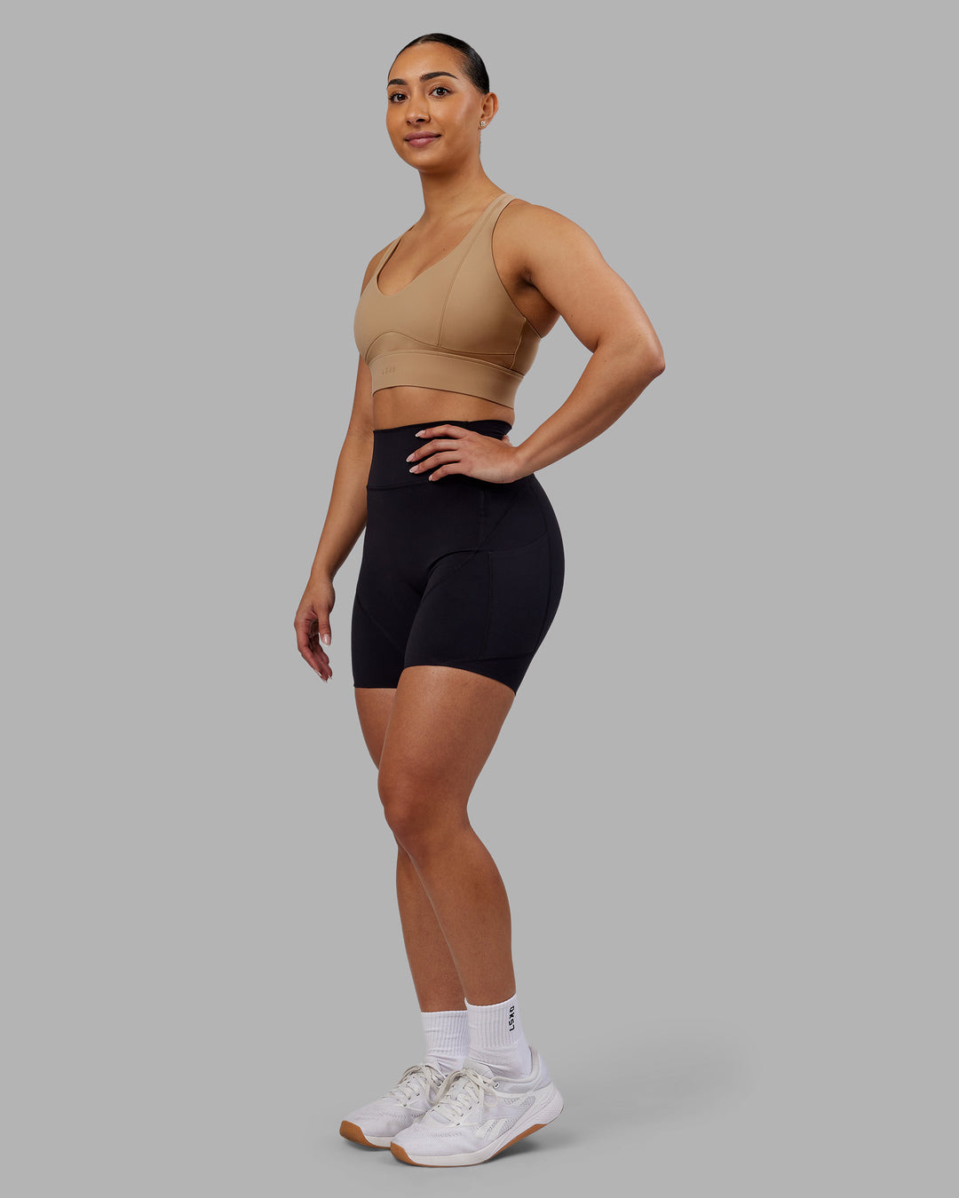 Woman wearing Sculpt Sports Bra - Warm Smoke| Model:Ayla | Size:S