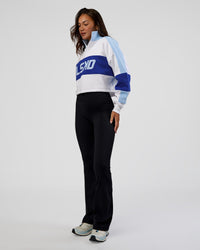 Woman wearing Slam Quarter Zip Sweater - White-Electric Indigo | Model:Kirstyn | Size:S