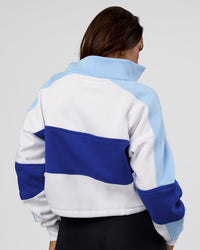 Woman wearing Slam Quarter Zip Sweater - White-Electric Indigo | Model:Kirstyn | Size:S