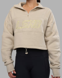Woman wearing Slam Quarter Zip Sweater - Shale Beige-Lime Glo | Model:Hannah | Size:S