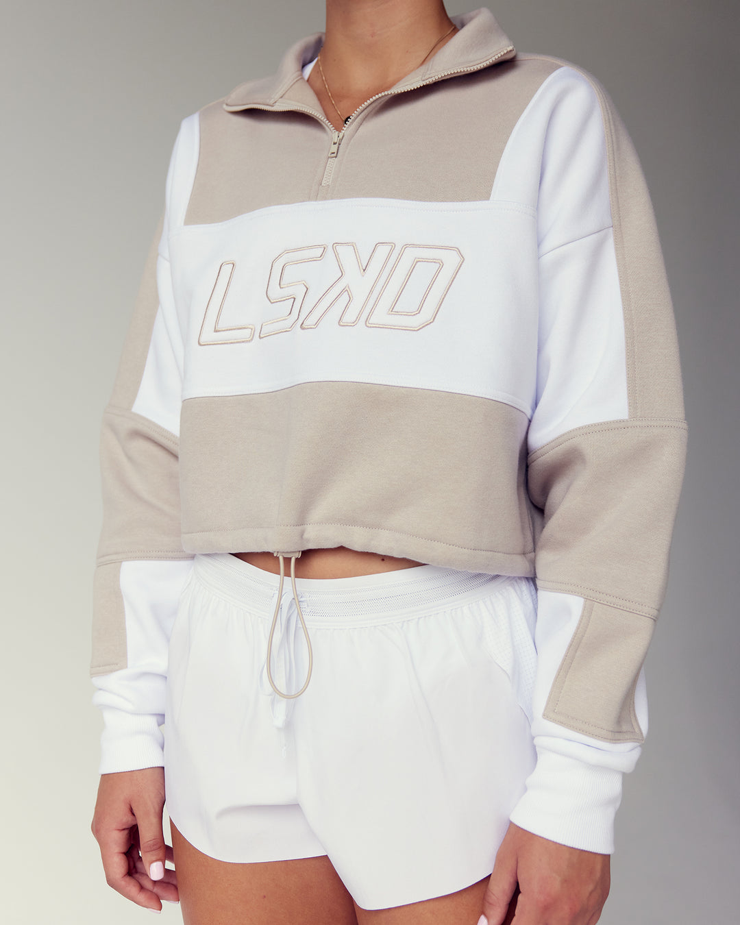 Woman wearing Slam Quarter Zip Sweater - Shale Beige-White | Model:Charlize | Size:S