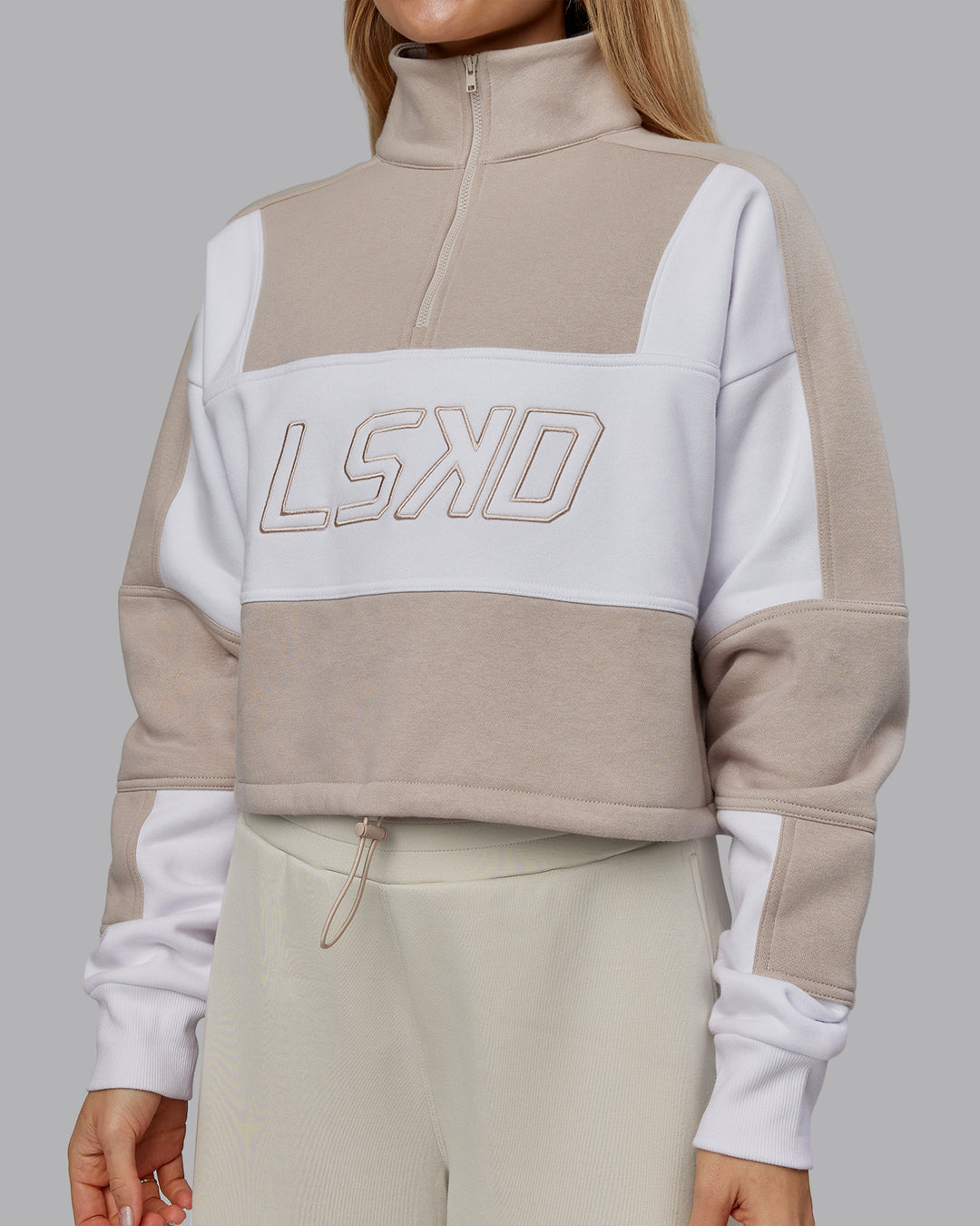 Woman wearing Slam Quarter Zip Sweater - Shale Beige-White | Model:Emilie | Size:S