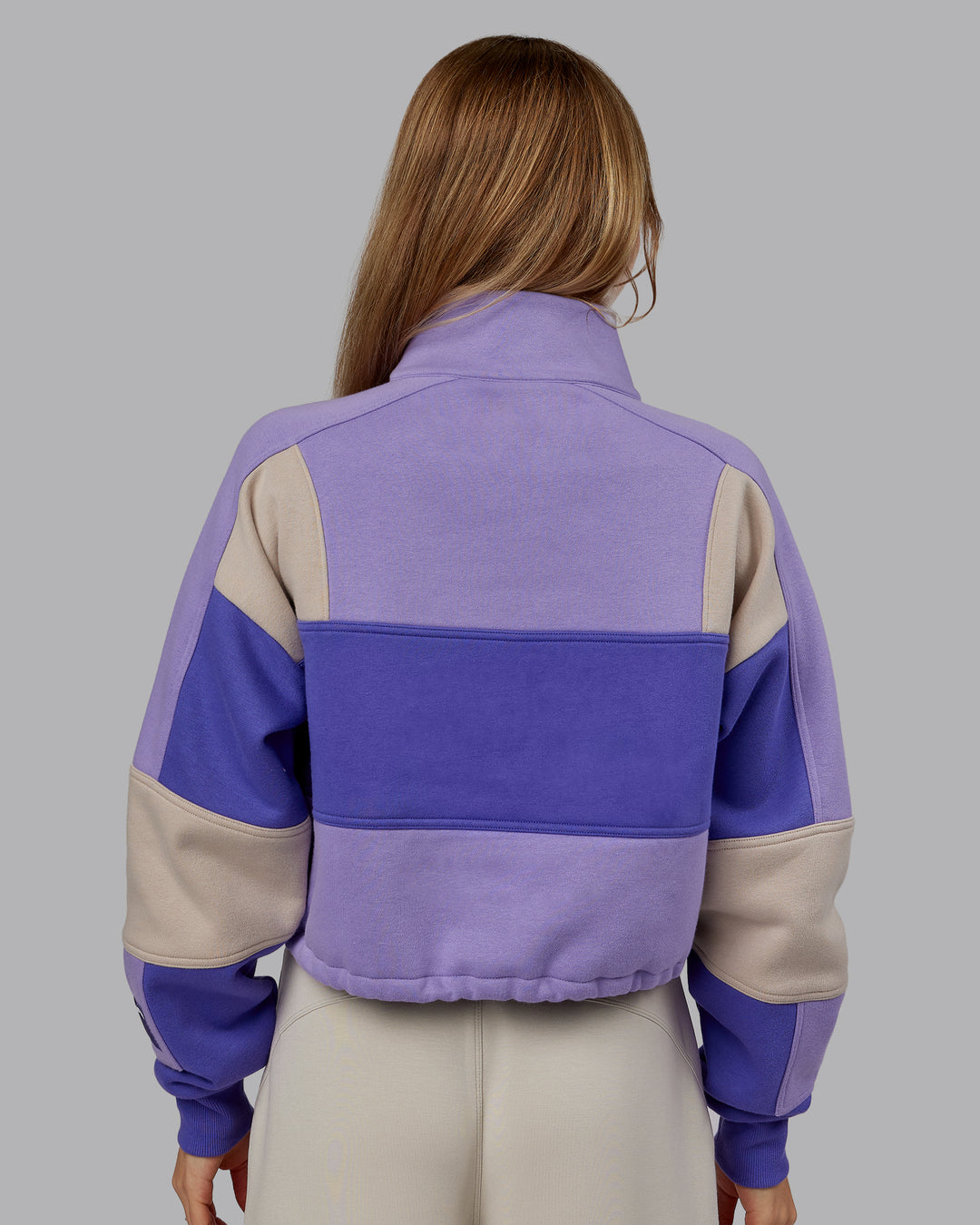 Woman wearing Slam Quarter Zip Sweater - Violet Ray-Royal Purple | Model:Emilie | Size:S