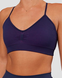 Woman wearing Spark Seamless Ribbed Sports Bra - Future Navy-Ultra Fuchsia | Model:Amity | Size:S