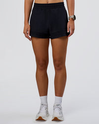 Woman wearing Sport Short 2.5" - Black | Model:Emelia | Size:S