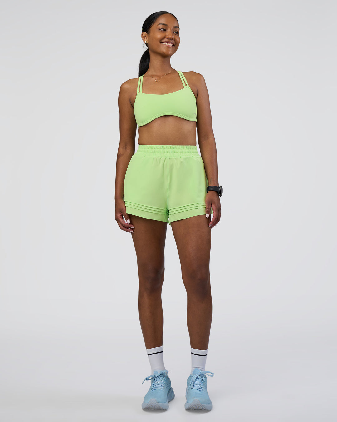 Woman wearing Sport Short 2.5&quot; - Solar Lime | Model:Rica | Size:S