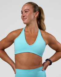 Woman wearing Stamina Pulse Sports Bra - Baltic Sea | Model:Sav | Size:S