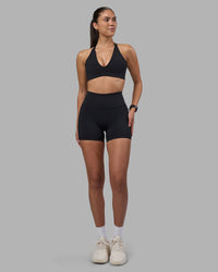 Woman wearing Stamina Pulse Sports Bra - Black | Model:Rhiley | Size:S