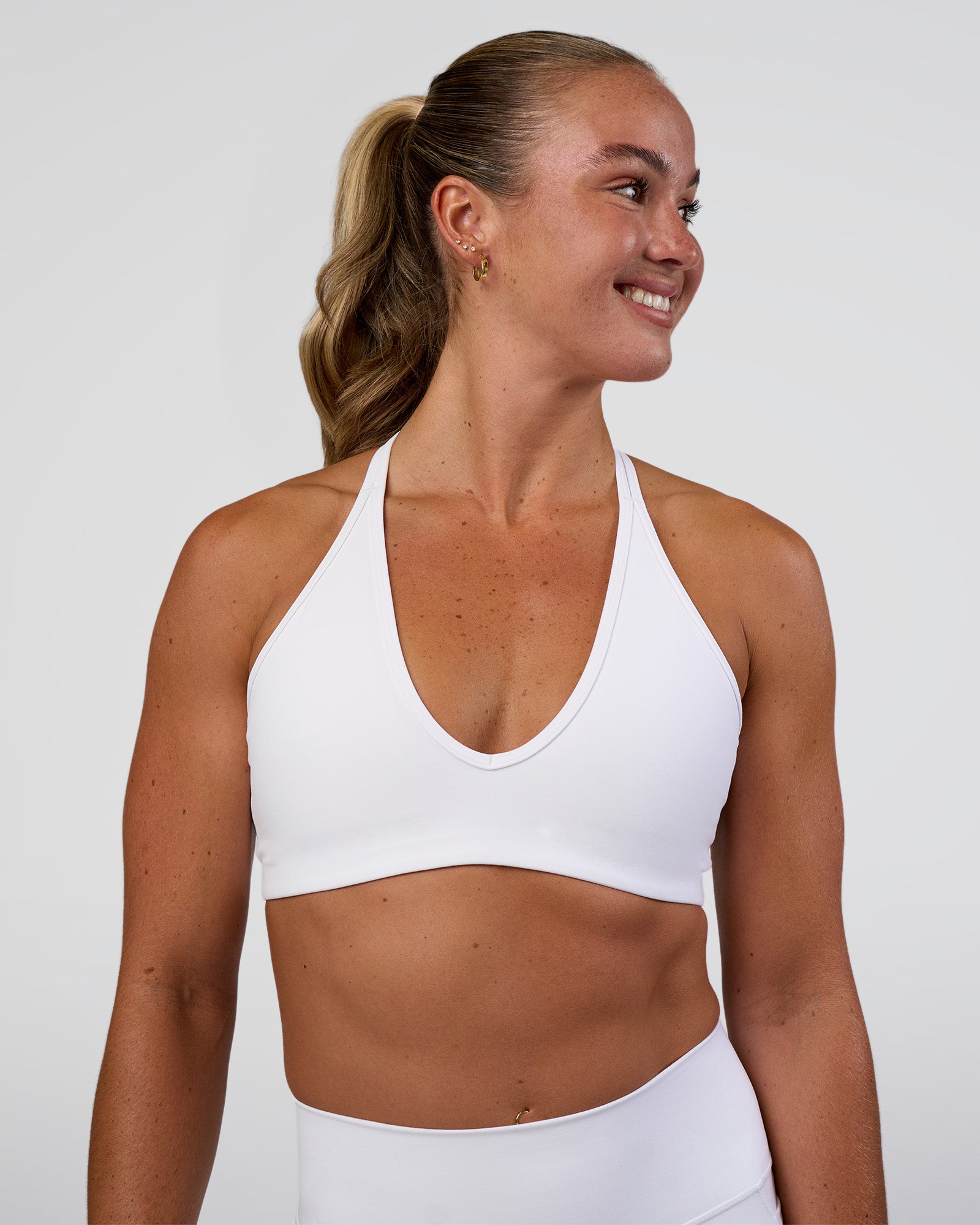 Woman wearing Stamina Pulse Sports Bra - White | Model:Sav | Size:S