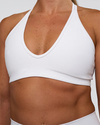 Woman wearing Stamina Pulse Sports Bra - White | Model:Sav | Size:S