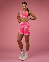 Woman wearing Stamina Rise Sports Bra - Pink Glow Print | Model:Hannah | Size:S