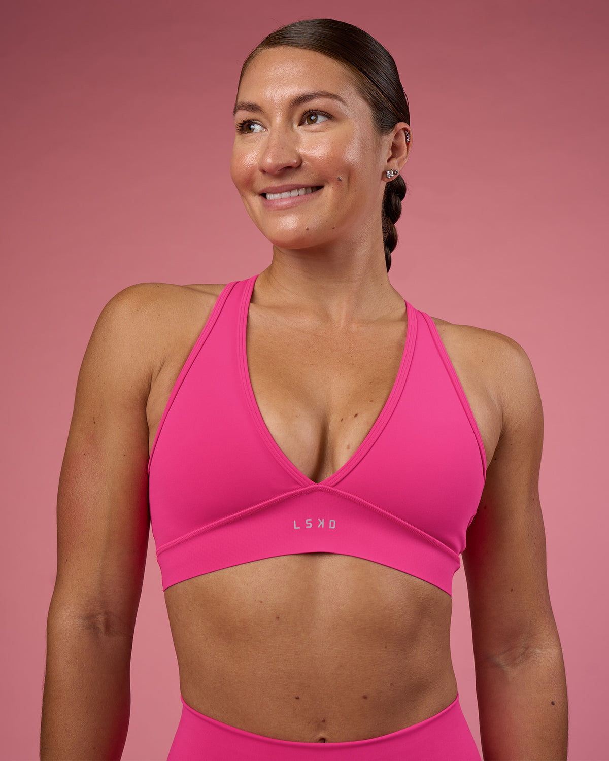 Woman wearing Stamina Rise Sports Bra - Ultra Pink | Model:Hannah | Size:S