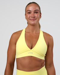 Woman wearing Stamina Rise Sports Bra - Yellow Fizz | Model:Sav | Size:S