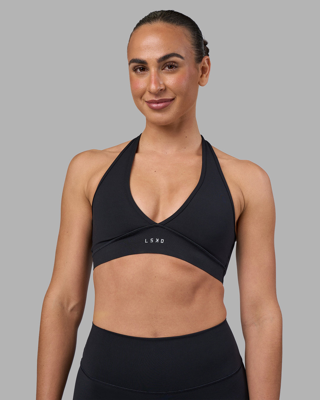 Woman wearing Stamina Sports Bra - Black | Model:Sophie | Size:S