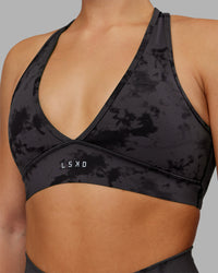 Woman wearing Stamina Sports Bra - Black Tie Dye | Set:true | Angle:closeup | Model:Keisha | Size:S | Thumbnail Index: 5