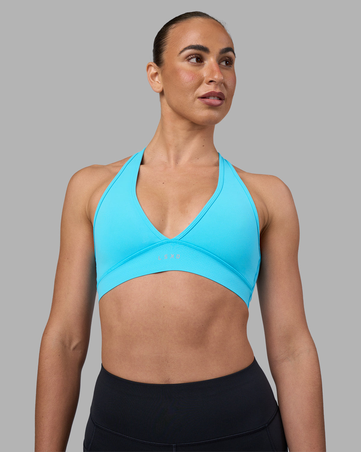 Woman wearing Stamina Sports Bra - Blue Atoll | Model:Sophie | Size:S