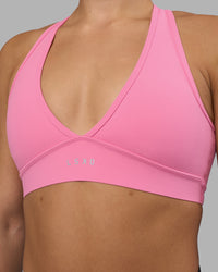 Woman wearing Stamina Sports Bra - Candy Pink | Set:true | Angle:closeup | Model:Keisha | Size:S