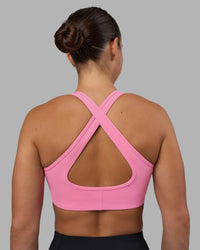Woman wearing Stamina Sports Bra - Candy Pink | Set:true | Angle:back | Model:Keisha | Size:S
