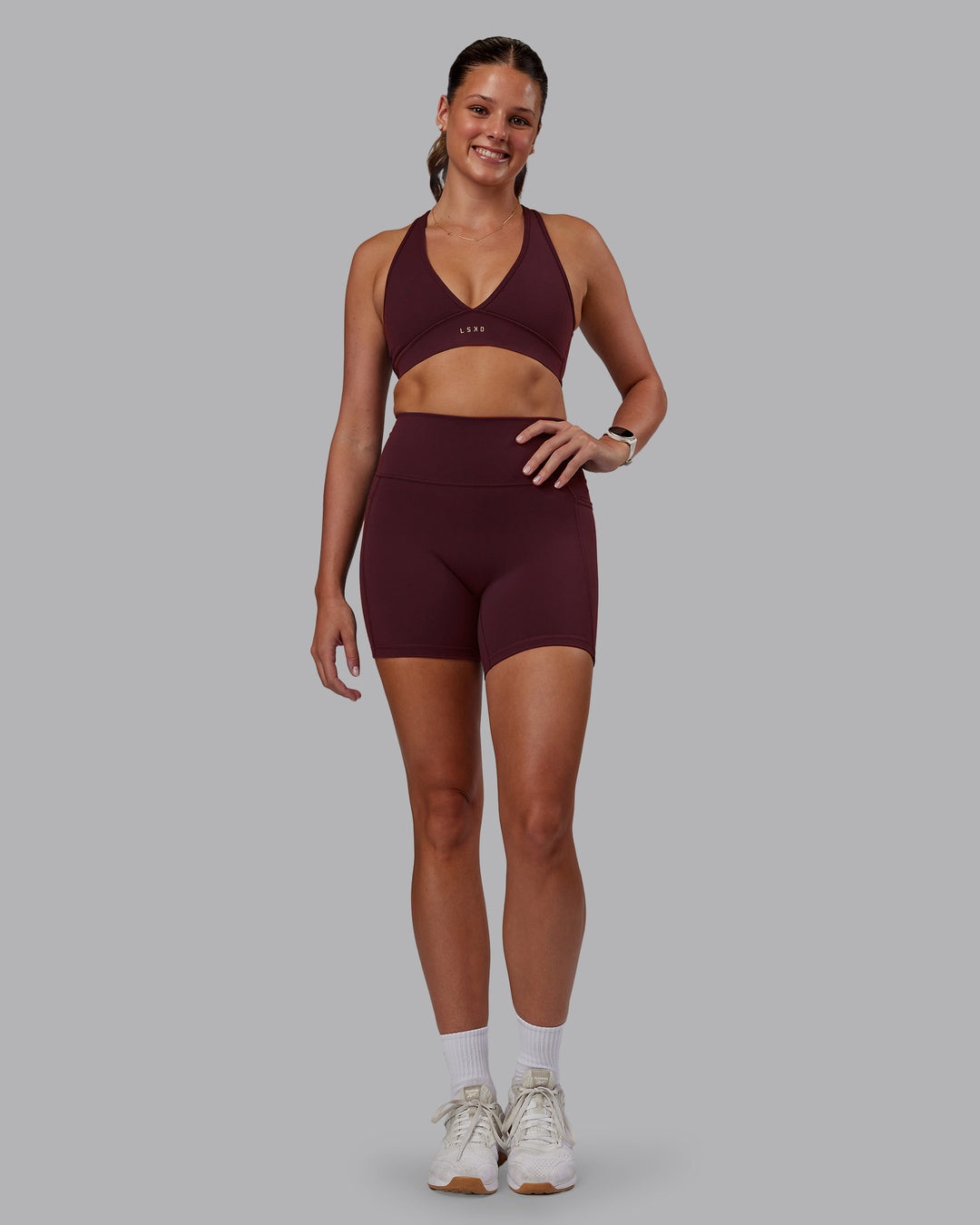 Woman wearing Stamina Sports Bra - Cherry Lacquer | Model:Phoebe | Size:S