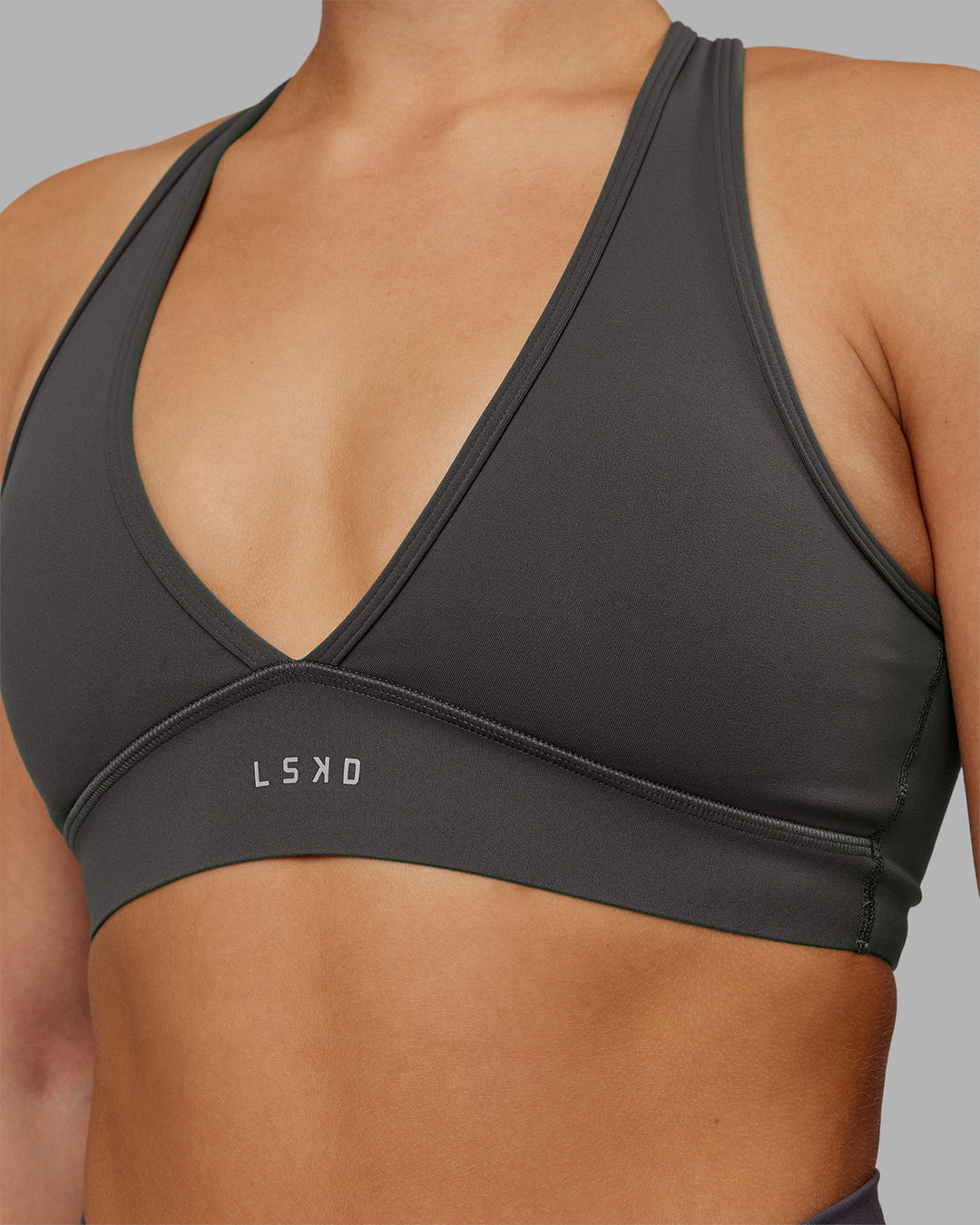 Woman wearing Stamina Sports Bra - Dark Storm | Model:Keisha | Size:S