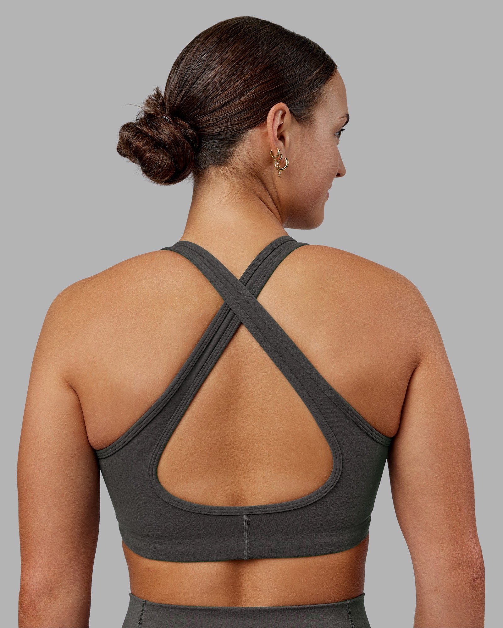 Woman wearing Stamina Sports Bra - Dark Storm | Model:Keisha | Size:S