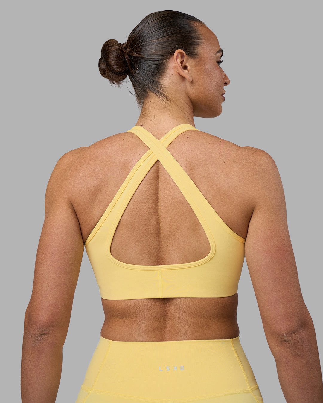 Woman wearing Stamina Sports Bra - Lemon | Model:Sophie | Size:S