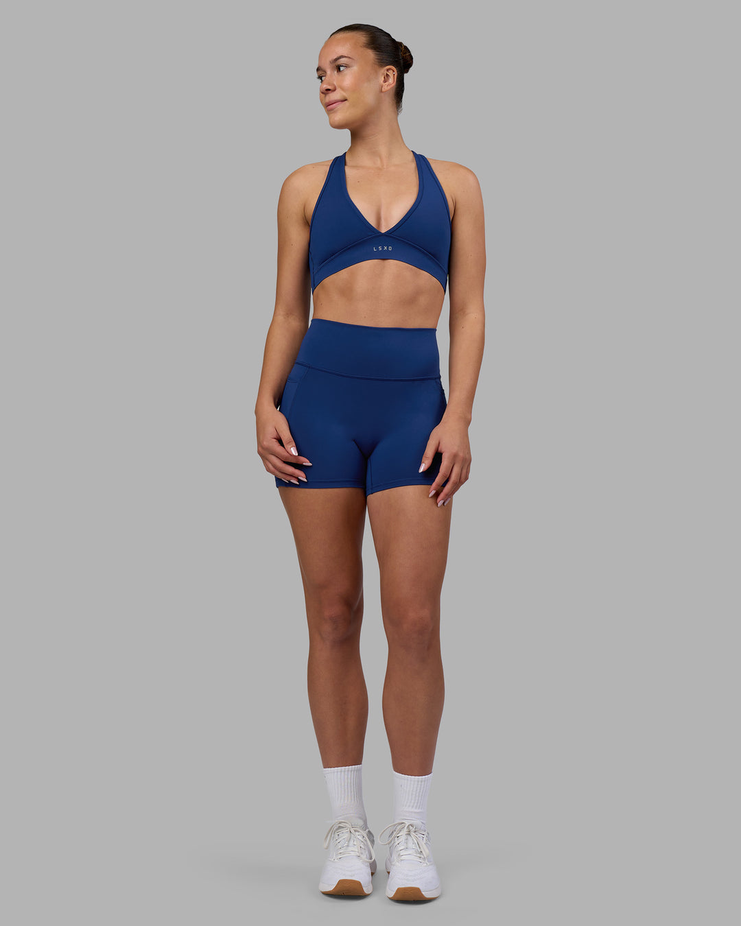 Woman wearing Stamina Sports Bra - Midnight Blue | Model:Charlize | Size:S