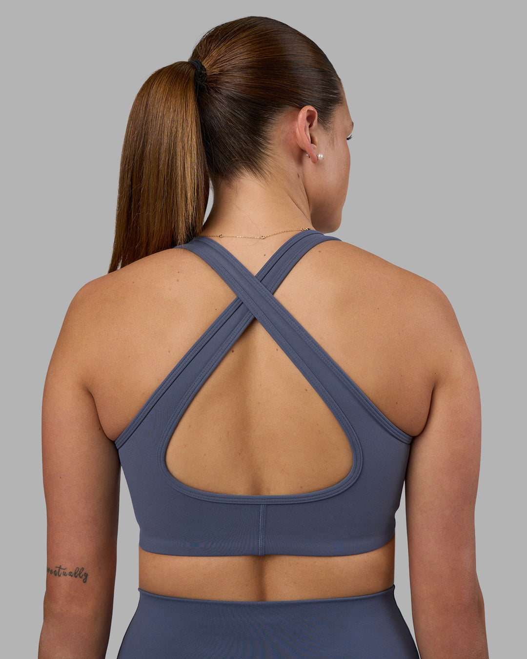 Woman wearing Stamina Sports Bra - Night Shadow | Model:Phoebe | Size:S