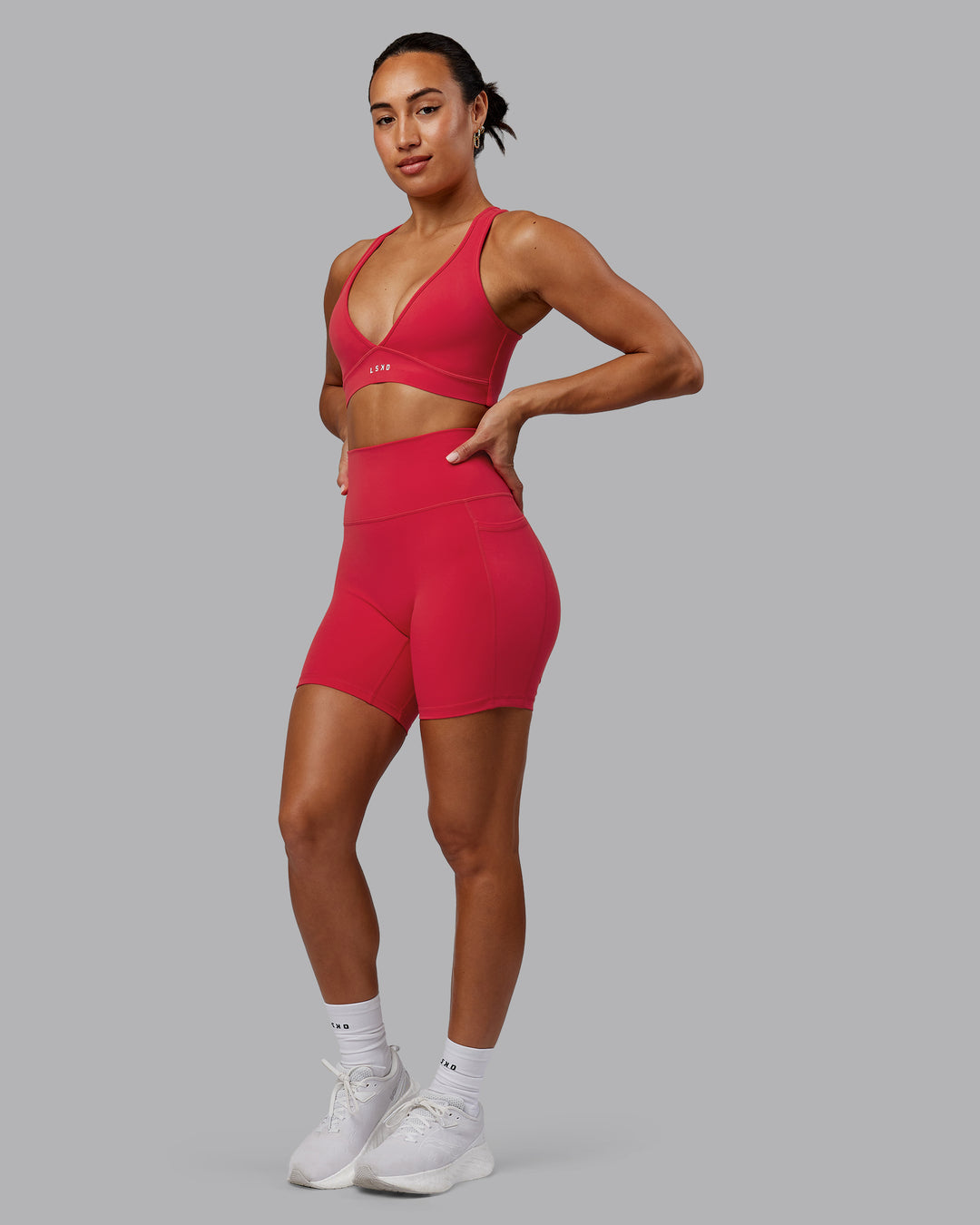 Woman wearing Stamina Sports Bra in Scarlet | Size:S