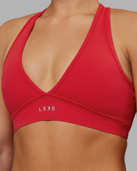 Woman wearing Stamina Sports Bra - Scarlet | Set:true | Angle:closeup | Model:Keisha | Size:S