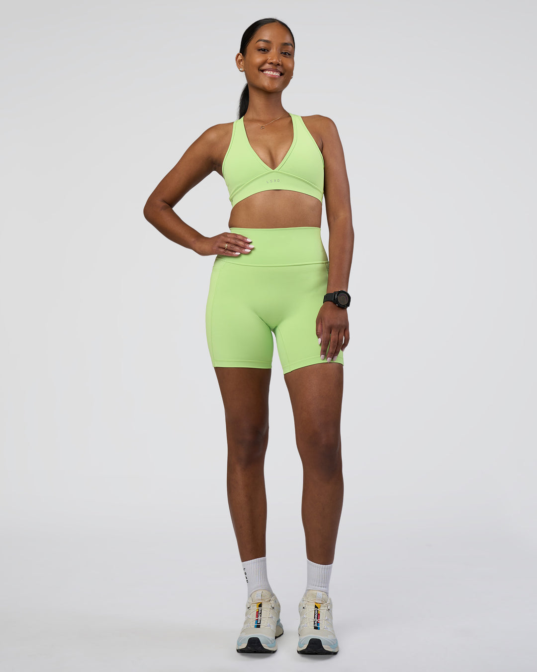 Woman wearing Stamina Sports Bra - Solar Lime | Model:Rica | Size:S
