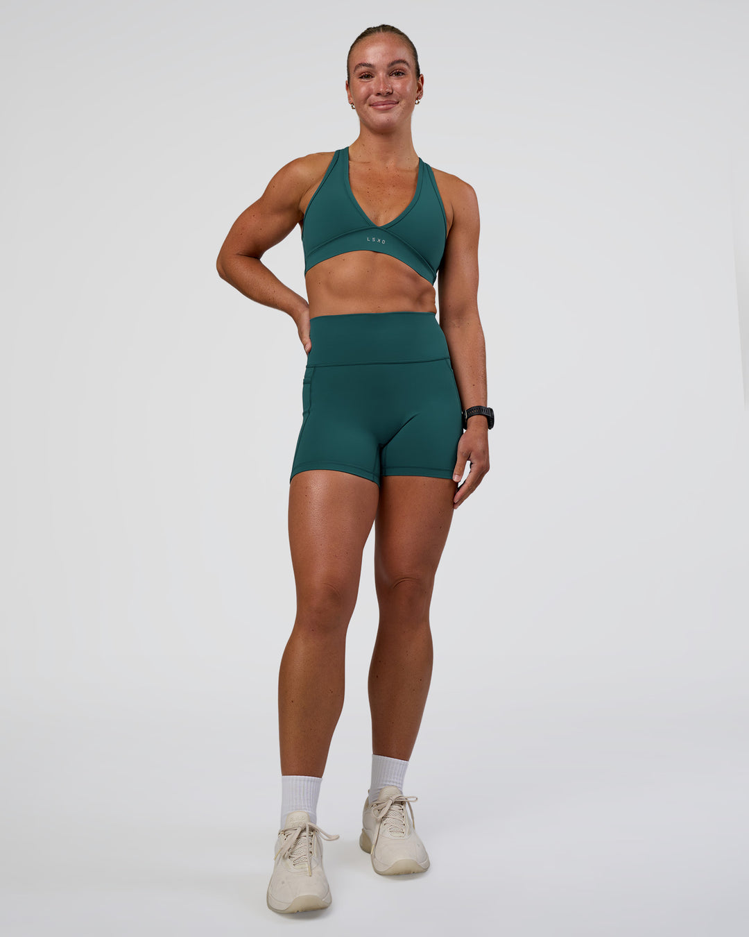 Woman wearing Stamina Sports Bra - Transformative Teal | Model:Sav | Size:S