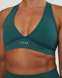 Woman wearing Stamina Sports Bra - Transformative Teal | Set:true | Angle:closeup | Model:Sav | Size:S