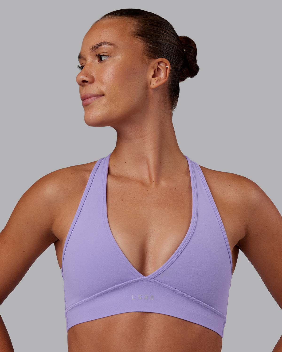 Woman wearing Stamina Sports Bra - Violet Ray | Model:Charlize | Size:S