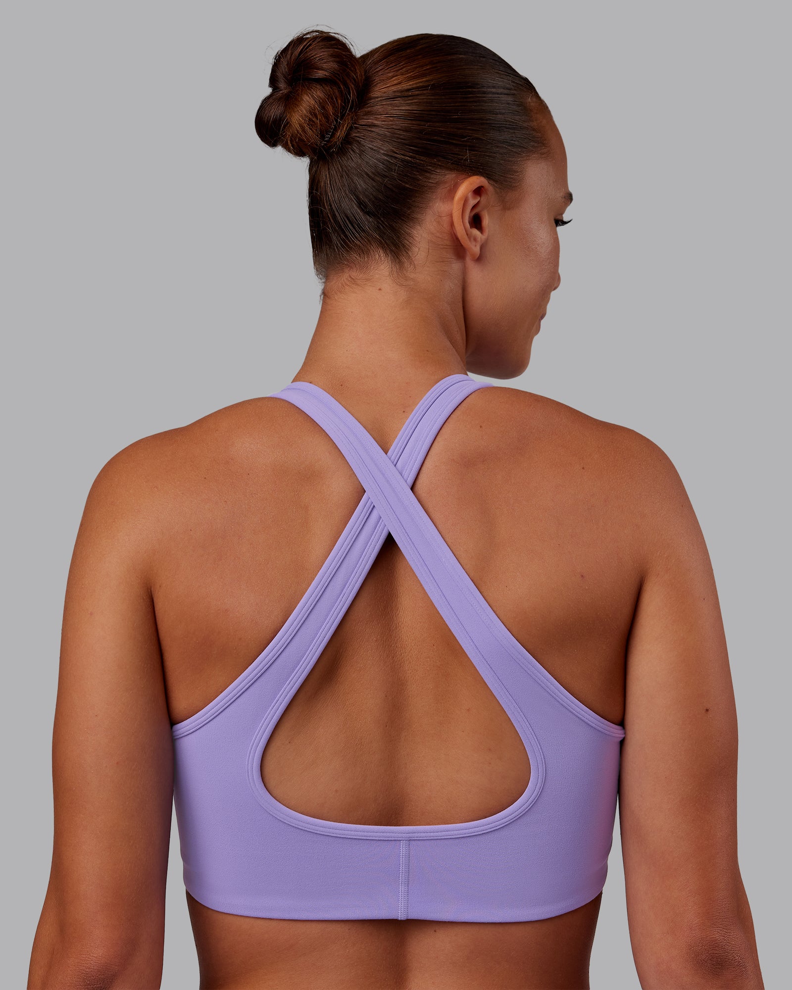 Woman wearing Stamina Sports Bra - Violet Ray | Model:Charlize | Size:S