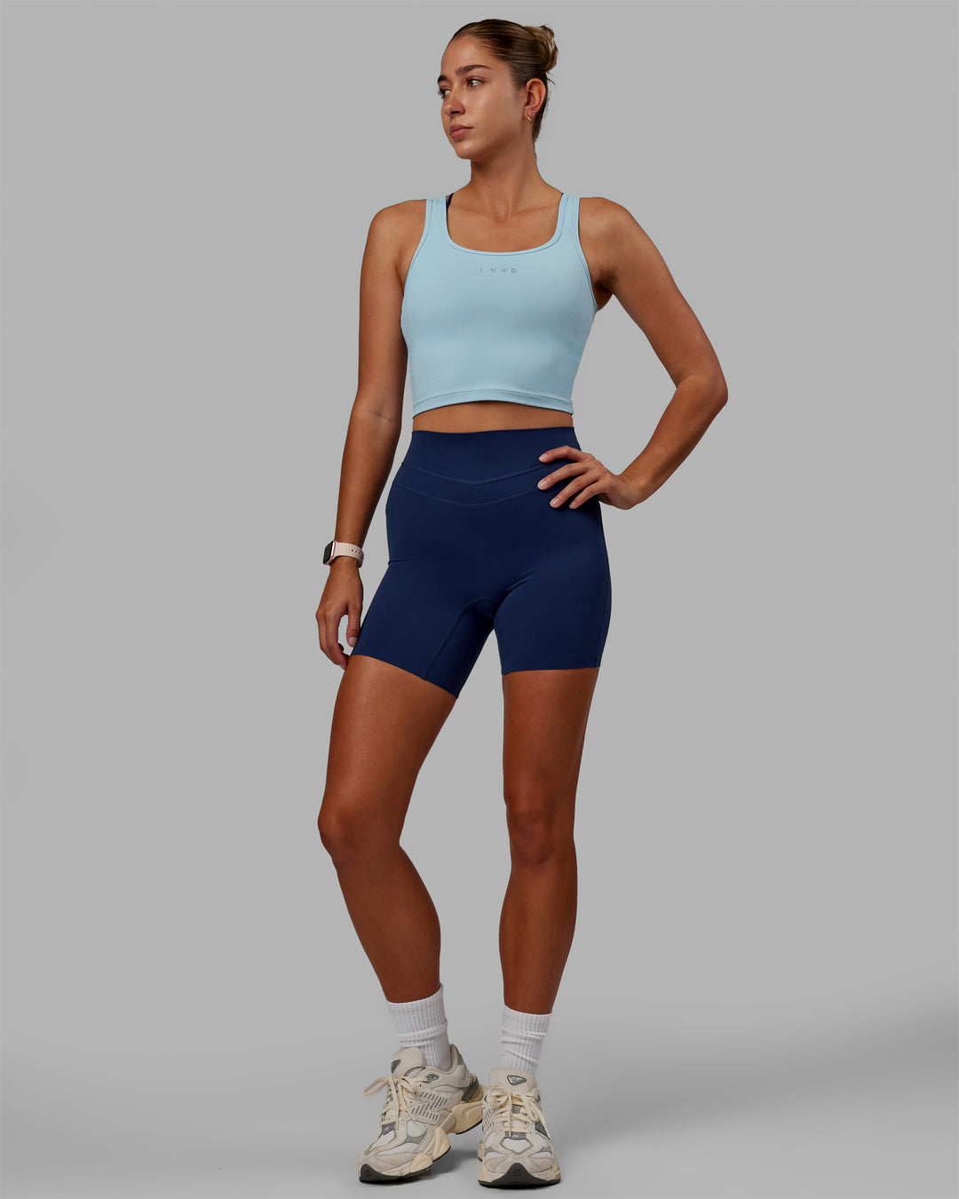 Woman wearing Staple Active Cropped Tank - Glacial Blue