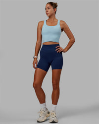 Woman wearing Staple Active Cropped Tank - Glacial Blue