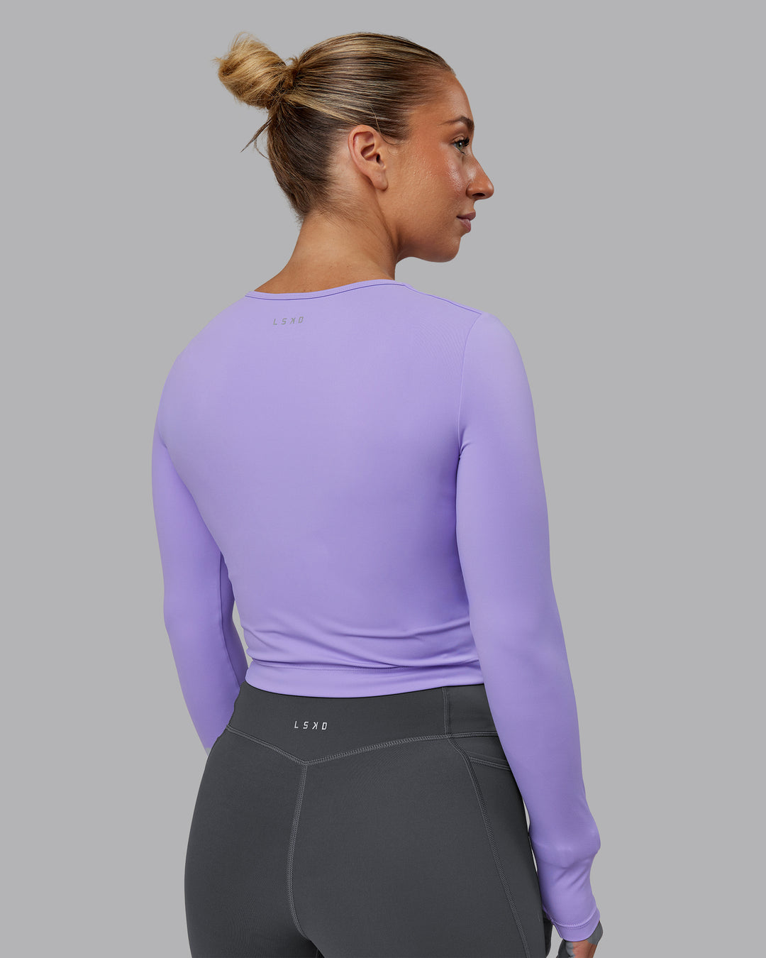 Woman wearing Staple Long Sleeve Cropped Tee in Violet Ray | Size:S