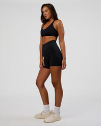 Woman wearing Stellar Sports Bra - Black | Model:Kirstyn | Size:S