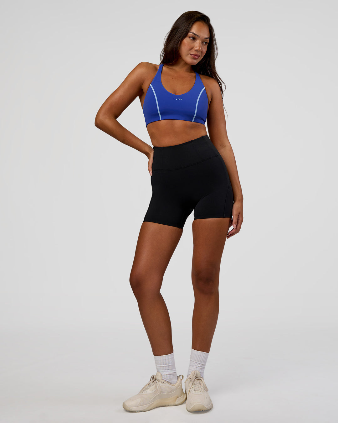 Woman wearing Stellar Sports Bra - Power Cobalt | Model:Kirstyn | Size:S