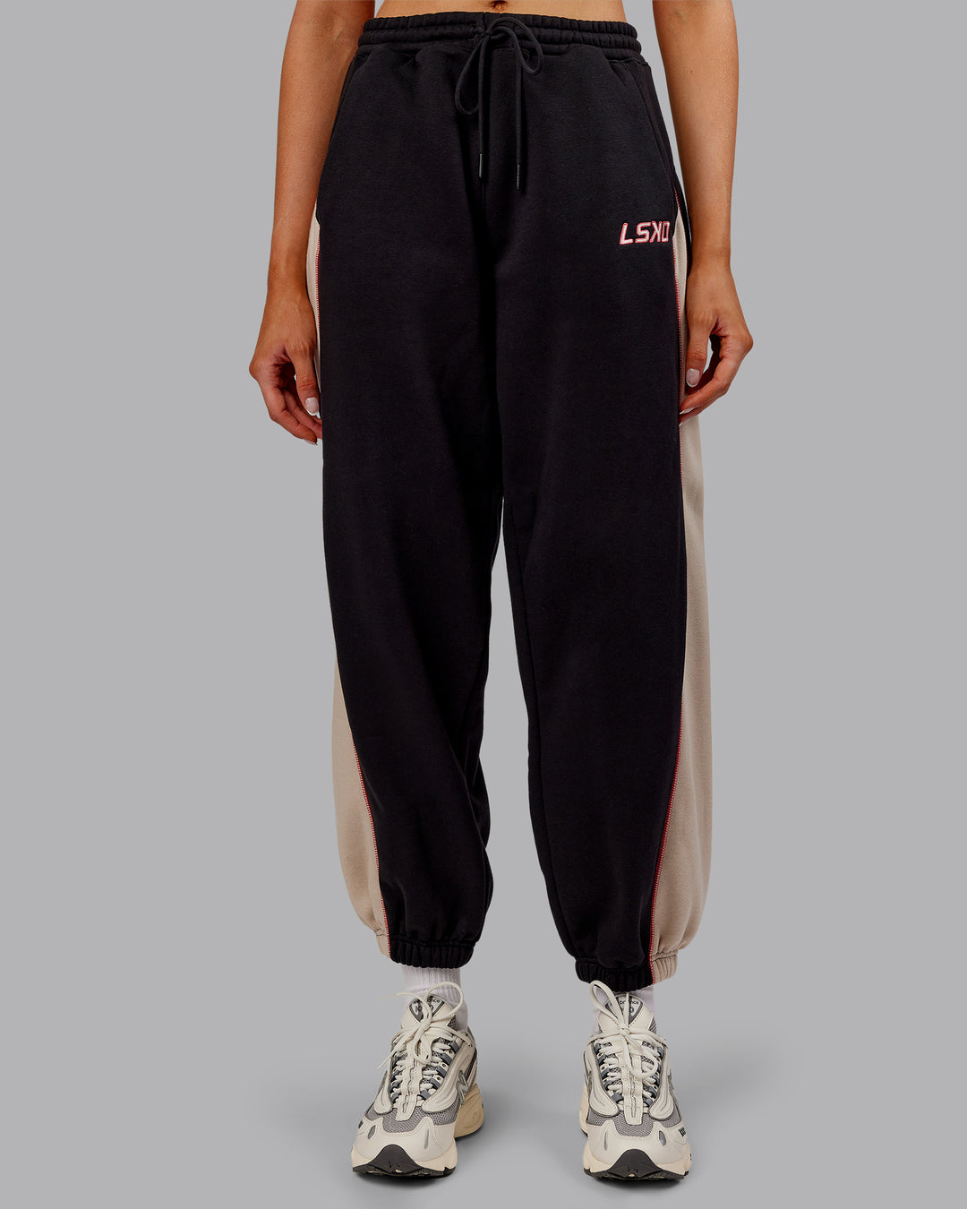Woman wearing Stitch Up Fleece Sweat Pant - Black/Shale Beige | Model:Ella | Size:S