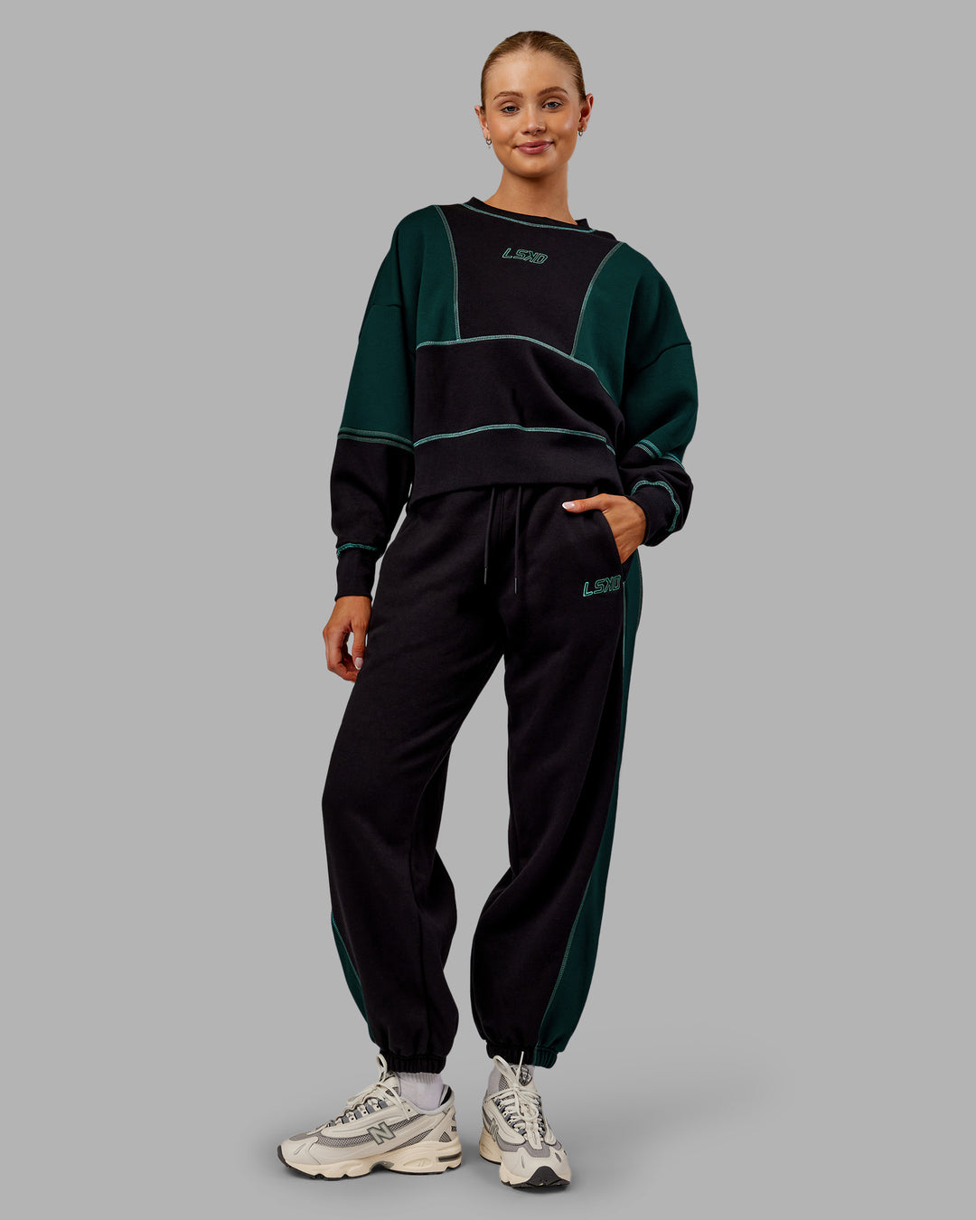 Woman wearing Stitch Up Oversized Fleece Sweater - Black-Dark Moss | Model:Ella | Size:S