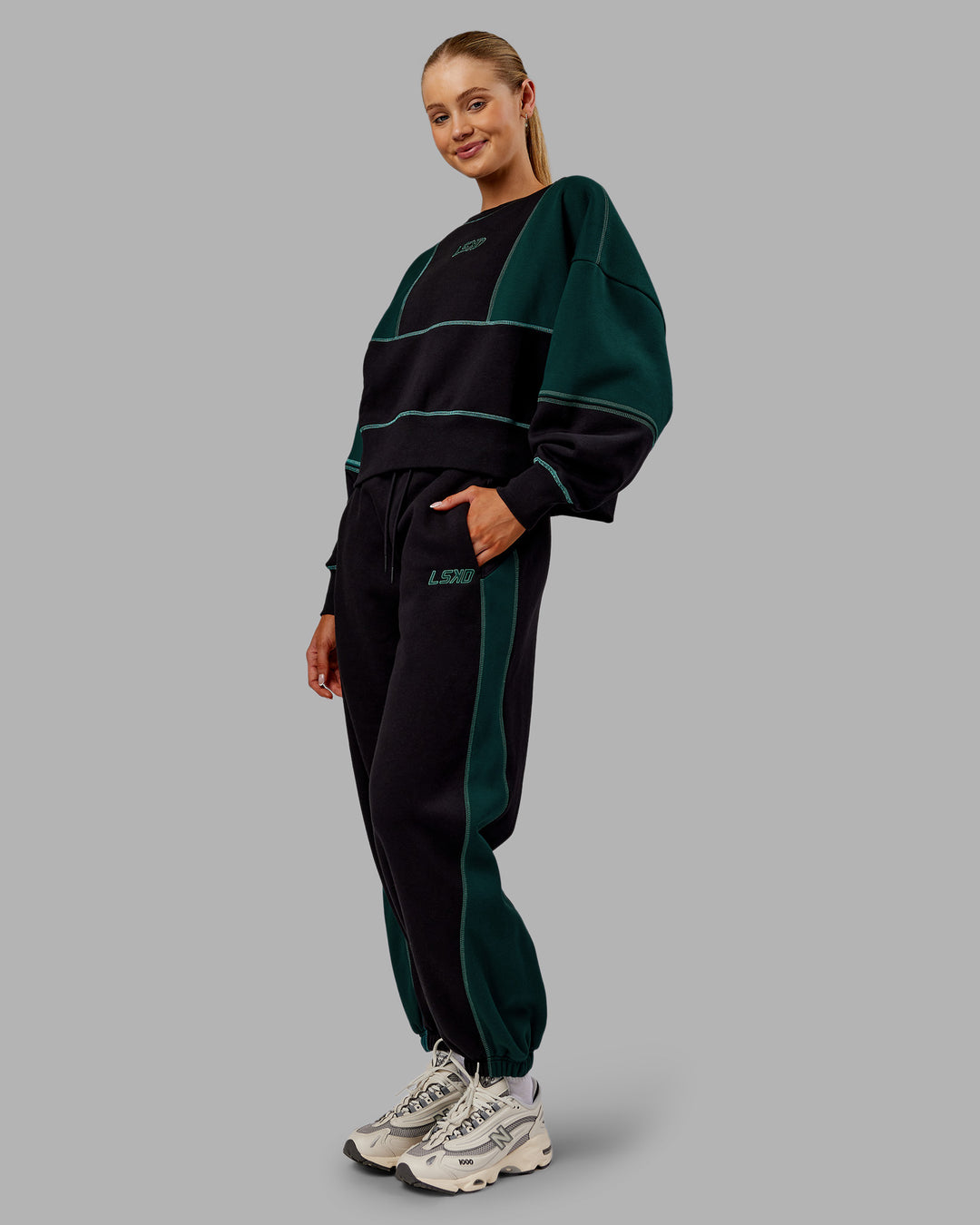 Woman wearing Stitch Up Oversized Fleece Sweater - Black-Dark Moss | Model:Ella | Size:S